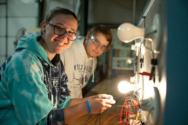 Female and male student working in technology lab